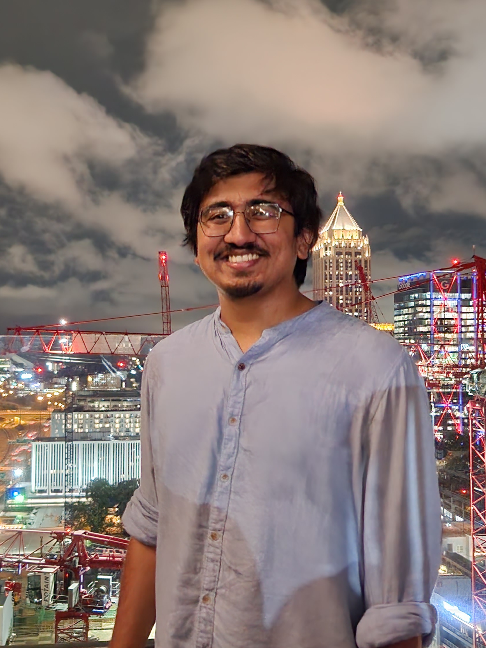 Varun standing on a rooftop in the city.