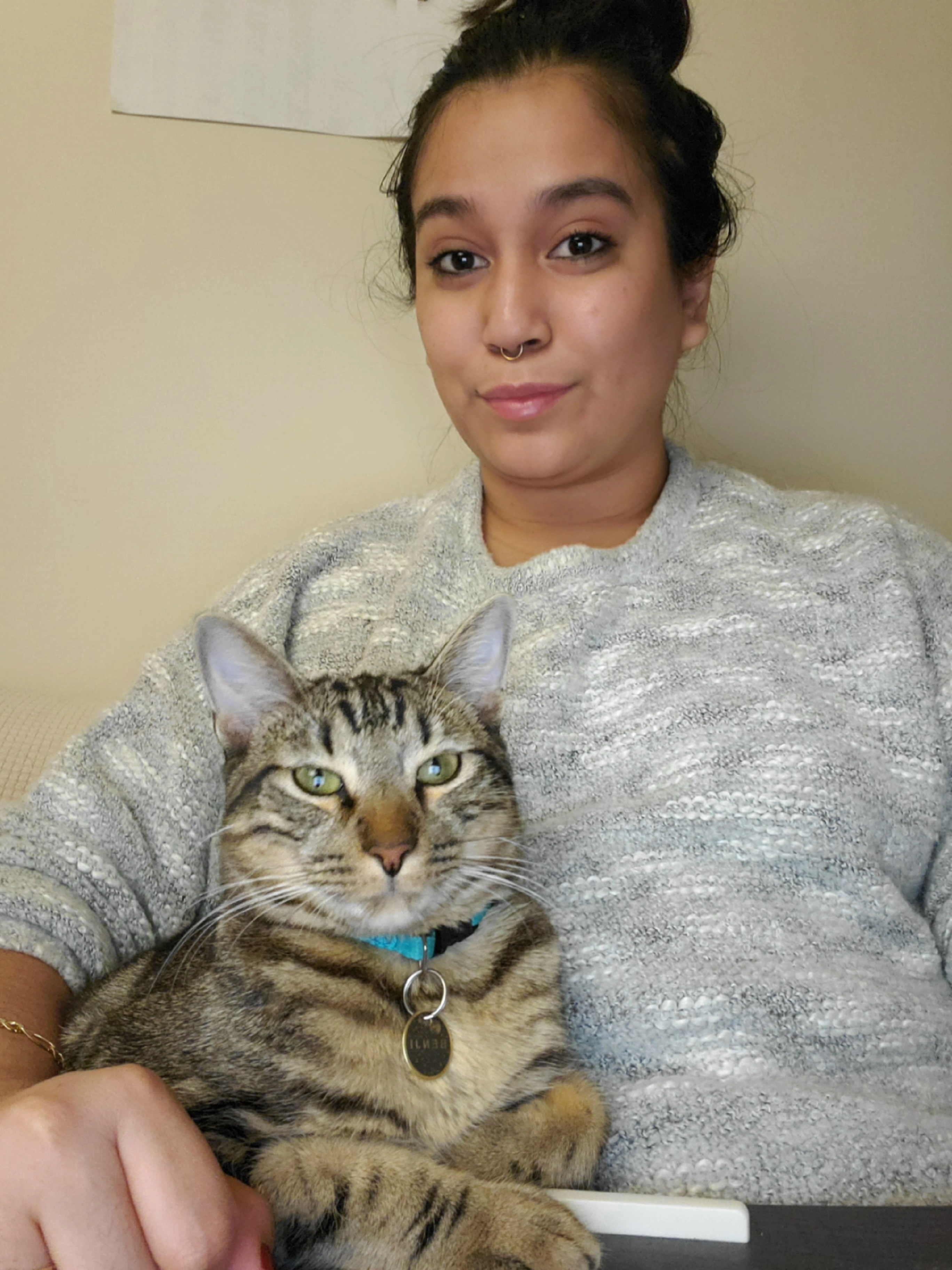 Becky sitting with her elegant cat Benji