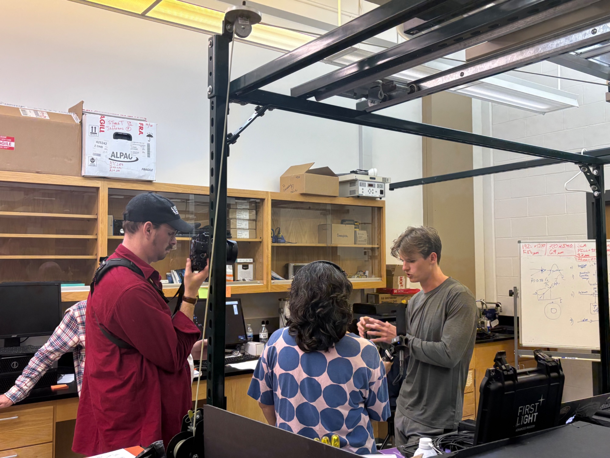 Billy O'Brien being interviewed in the lab by WABE Radio
