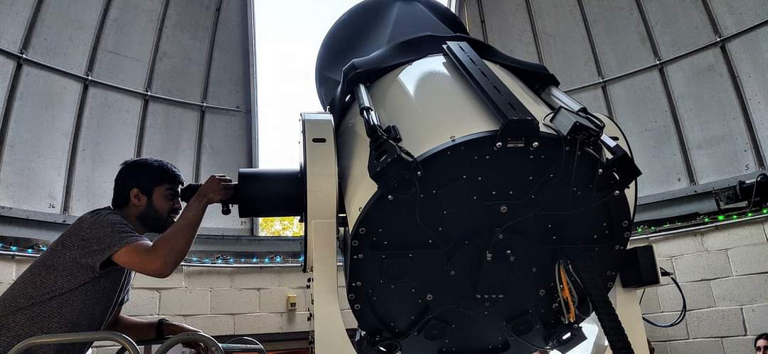 A visitor looking through the telescope