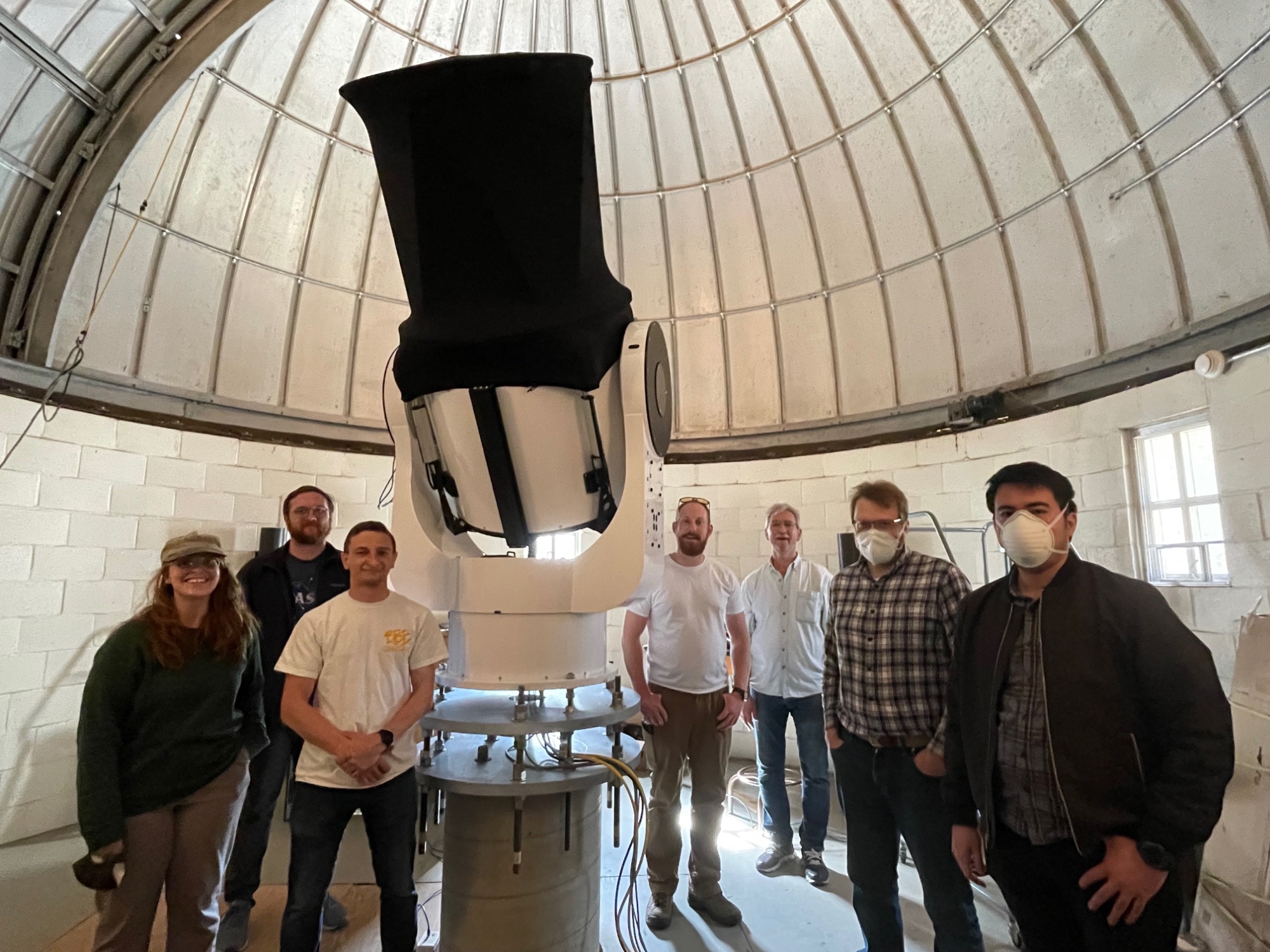 Team installing telescope at HLCO